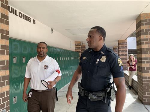 Officer Johnson walks the halls of J.Hop with Principal Jones. 